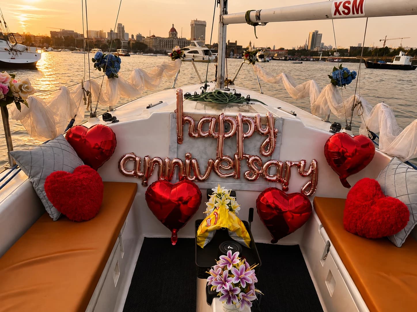 A happy anniversary balloon display on the bow at sunset