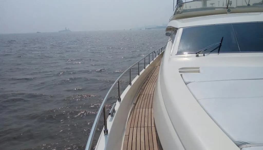 The foredeck and teak side deck viewed from Allegra's bow rail