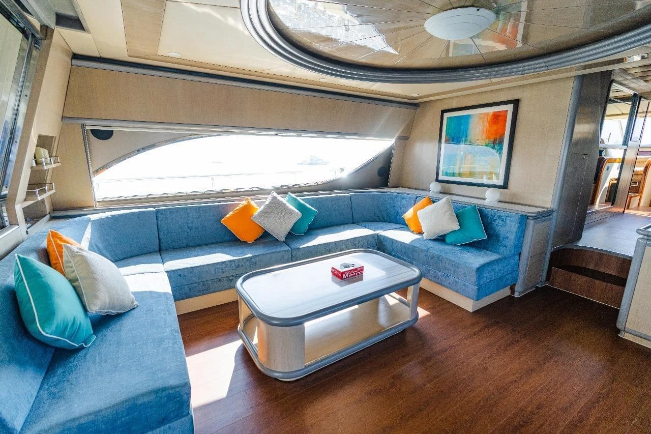 The saloon's modern refit, with blue upholstery, wood flooring and a mirrored ceiling medallion