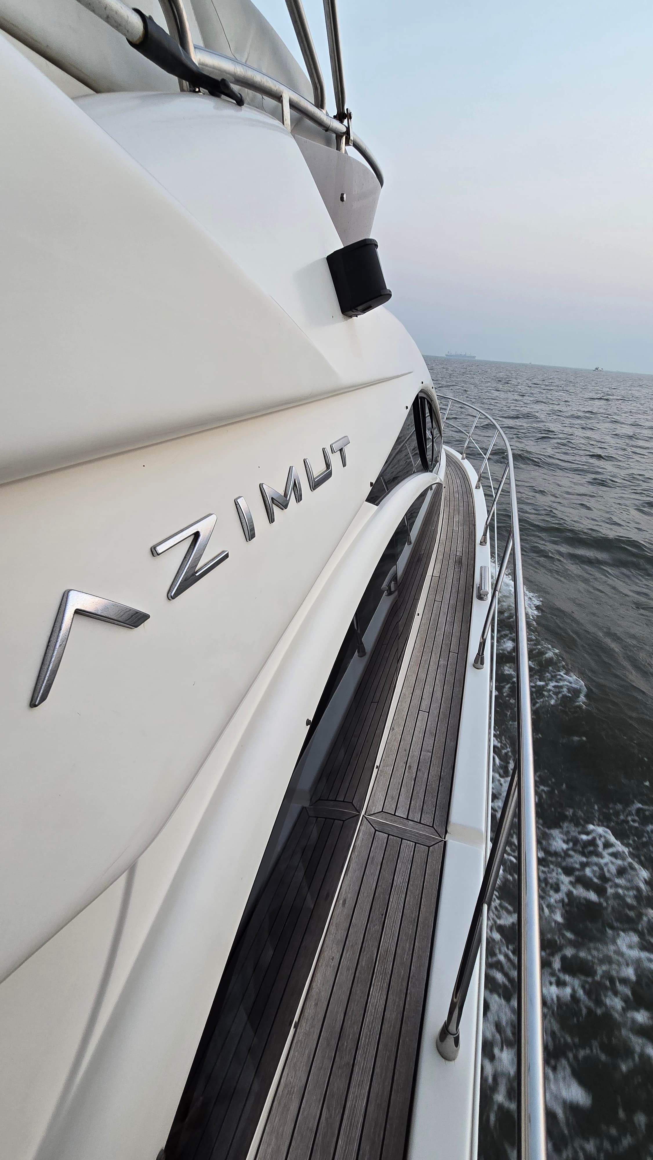 Close-up of the AZIMUT nameplate on the bow underway