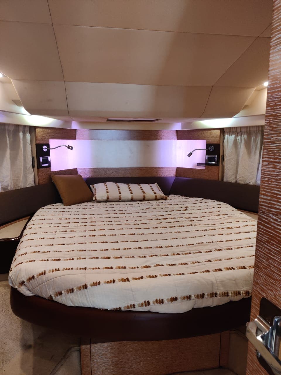 The master cabin's round double bed with mood lighting