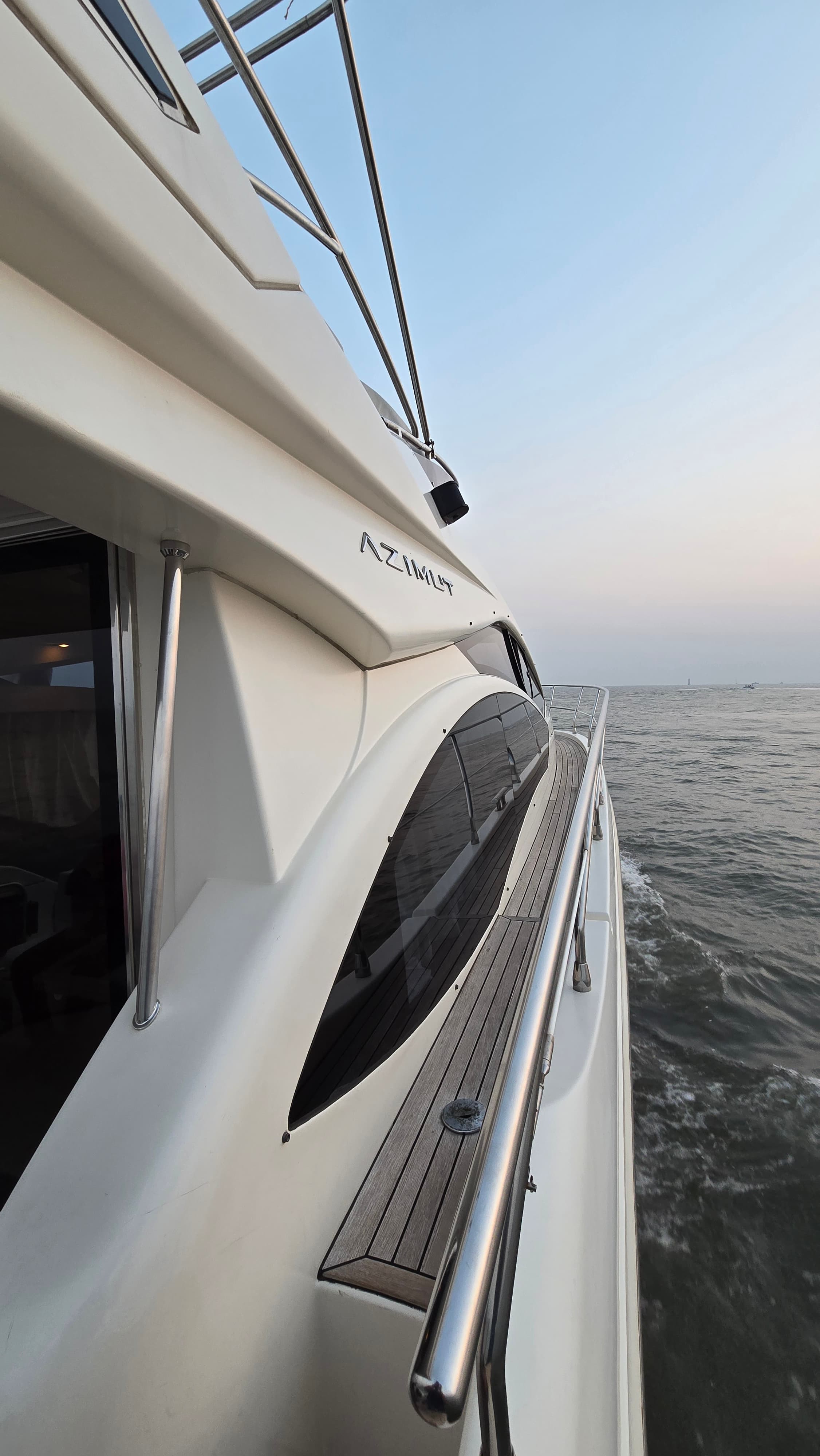 A crew member on the side deck as the yacht gets under way