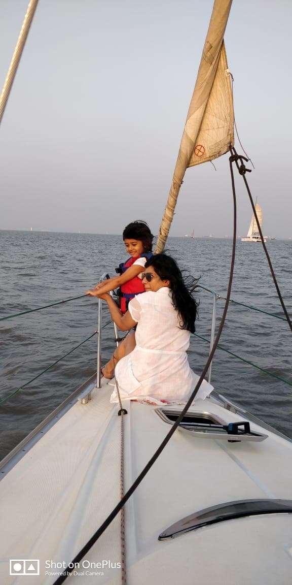 A mother and child at the helm together as Flo gets under way