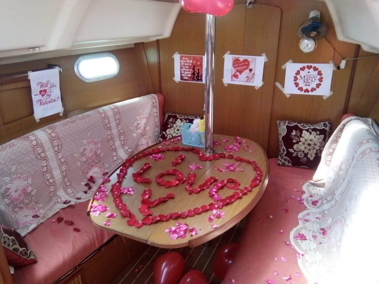 A rose-petal "Love" message and Valentine signage laid out in the saloon