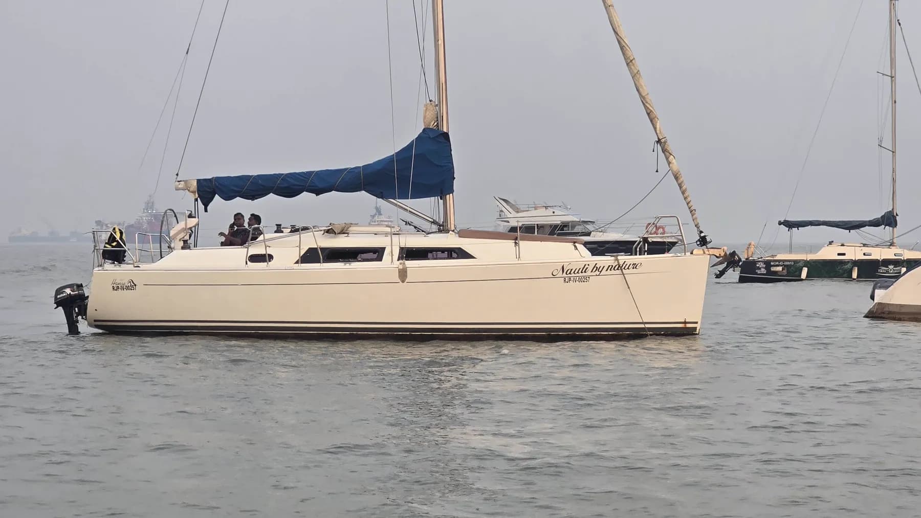 Nauti by Nature at anchor, her name, Hanse logo and registration RJP-IV-00257 visible on the hull