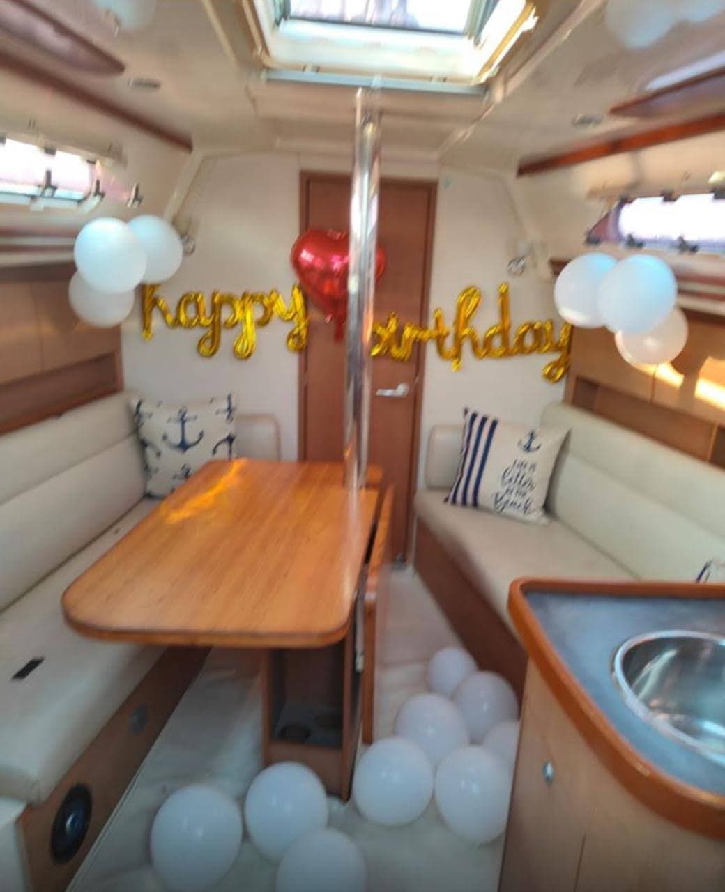 A happy birthday balloon display in the saloon