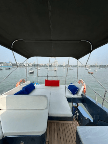 The foredeck lounge seating with the city skyline behind