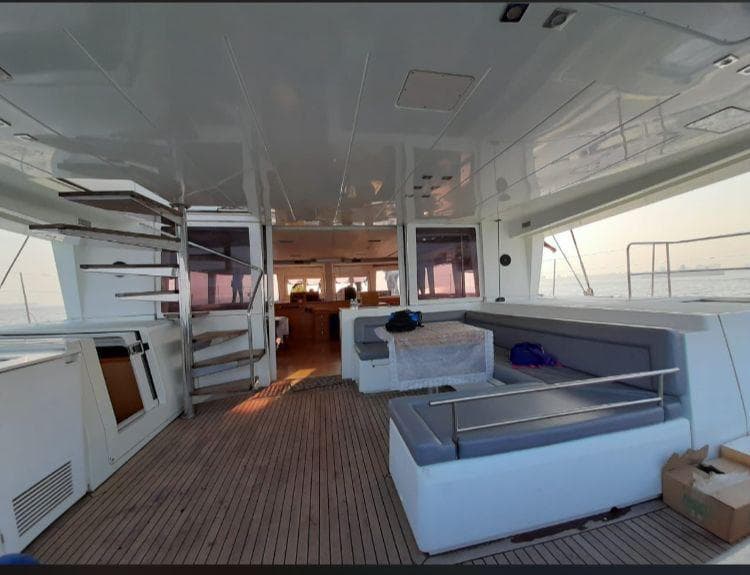 The aft deck looking toward the enclosed saloon and spiral staircase