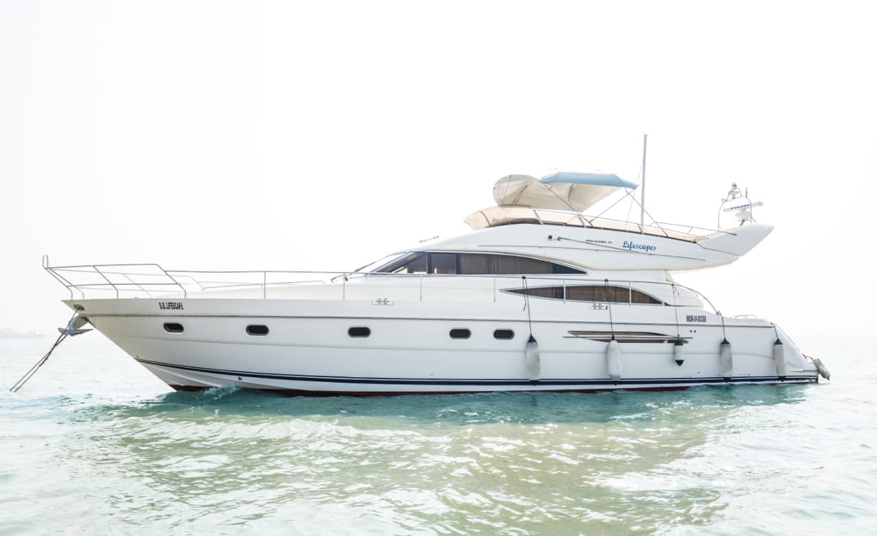 Princess 61 yacht at anchor in Mumbai harbour on a hazy morning