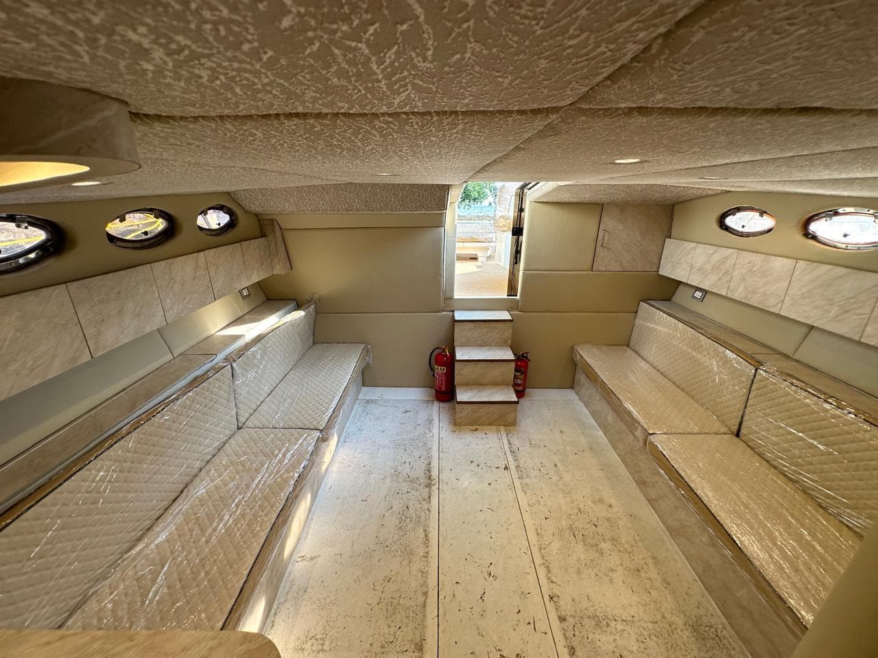 The lower saloon seating either side of the companionway steps