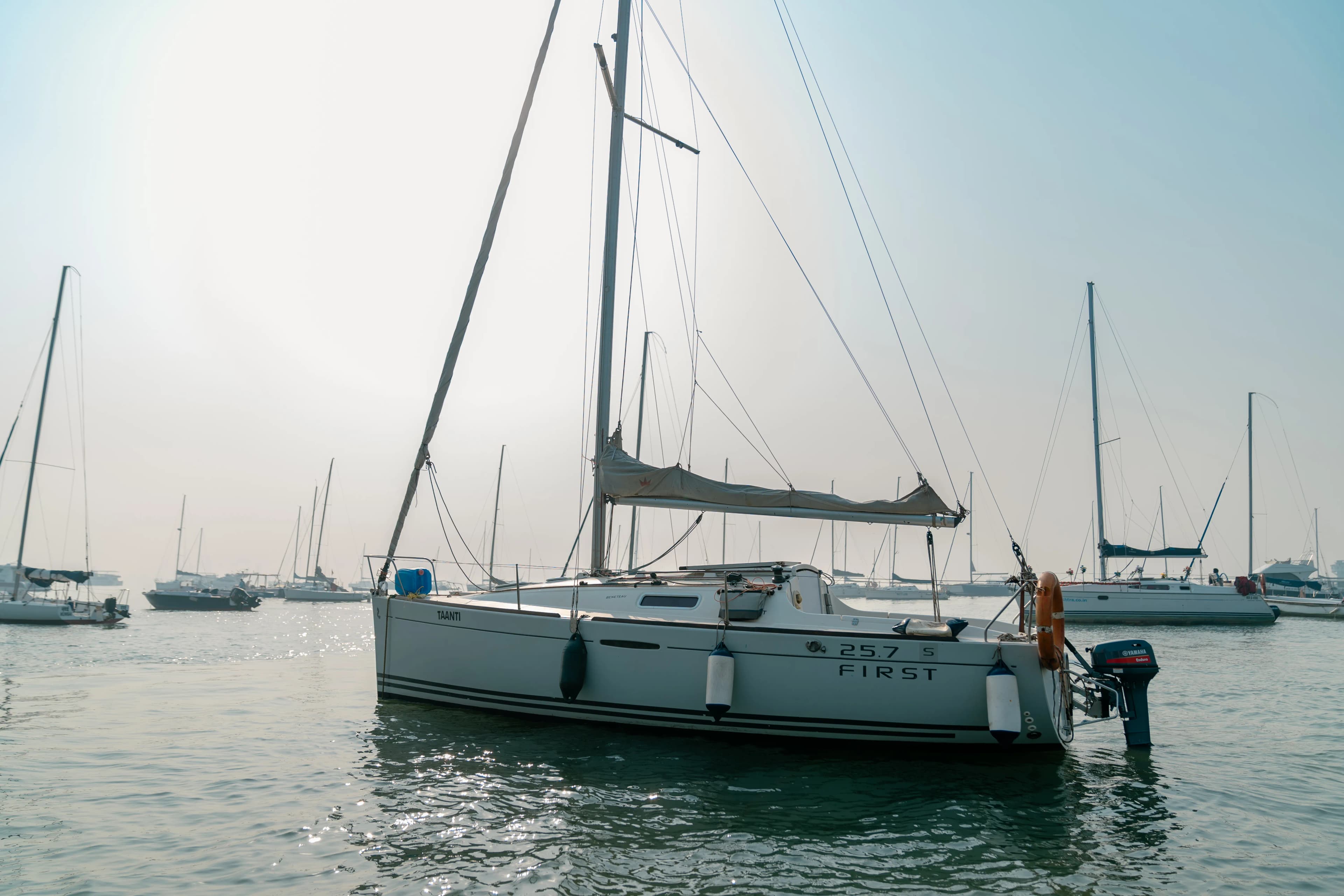 The Beneteau First 25.7 nameplate and outboard on Taanti's transom