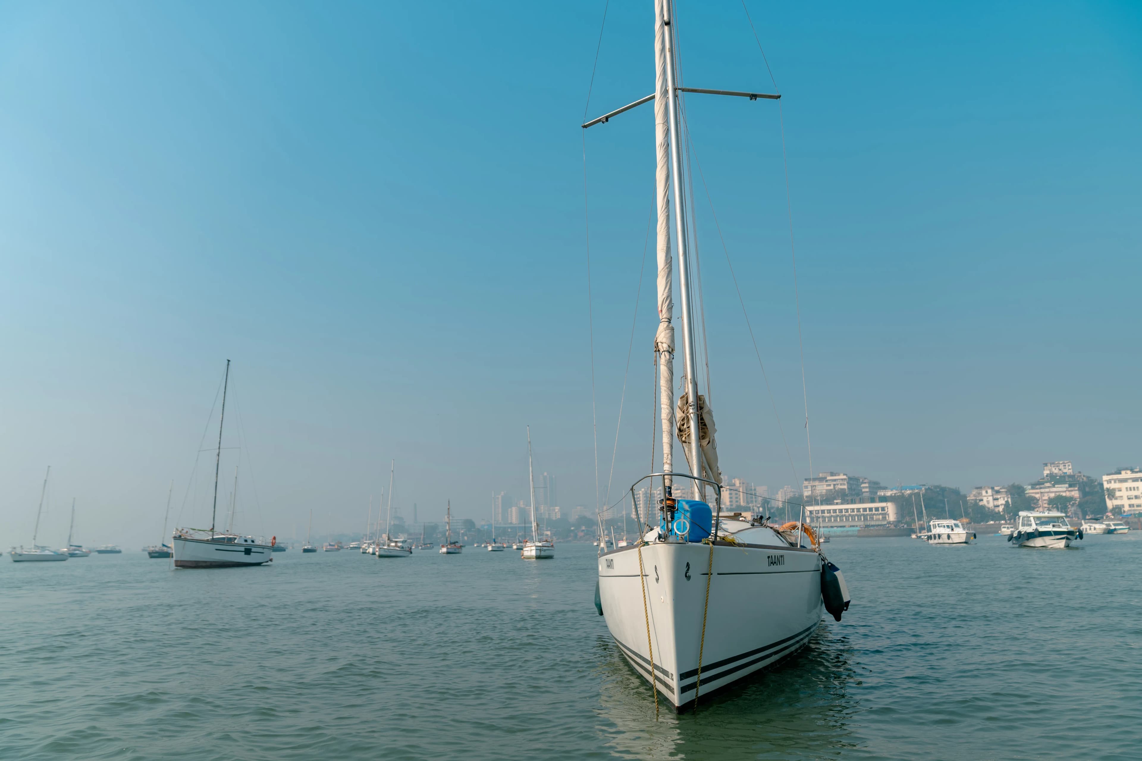 Taanti's bow at anchor in a crowded Mumbai harbour anchorage
