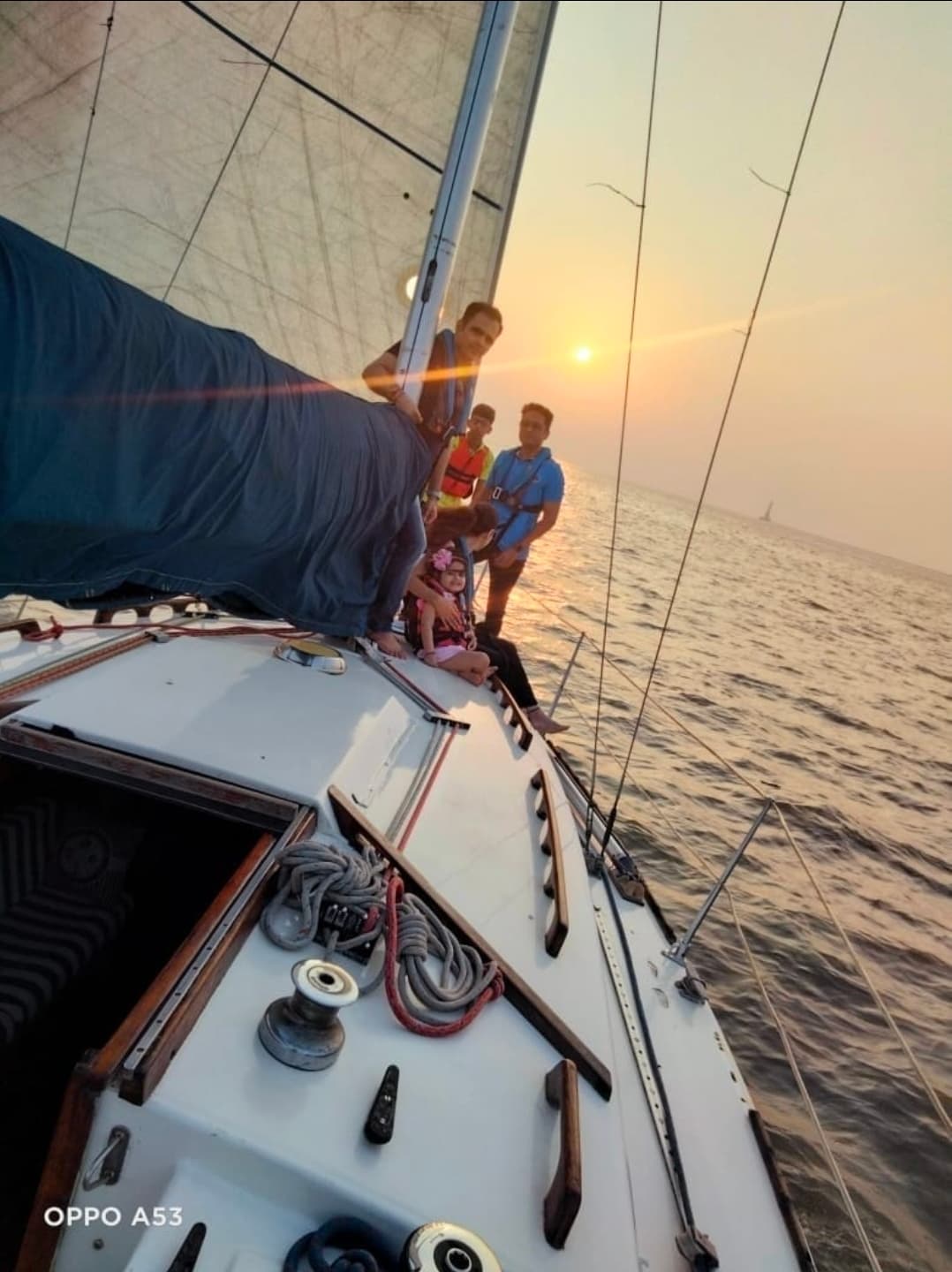 A family group at the bow at sunset as Tantallon sails on