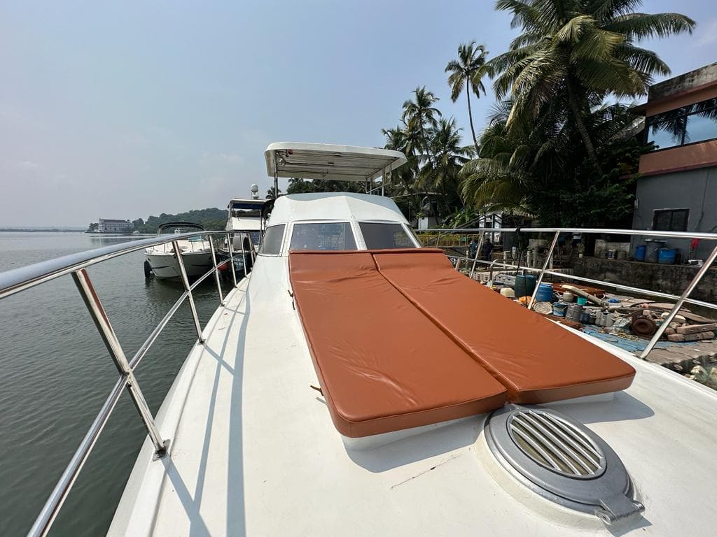 The foredeck sun pad and rail looking out over the river