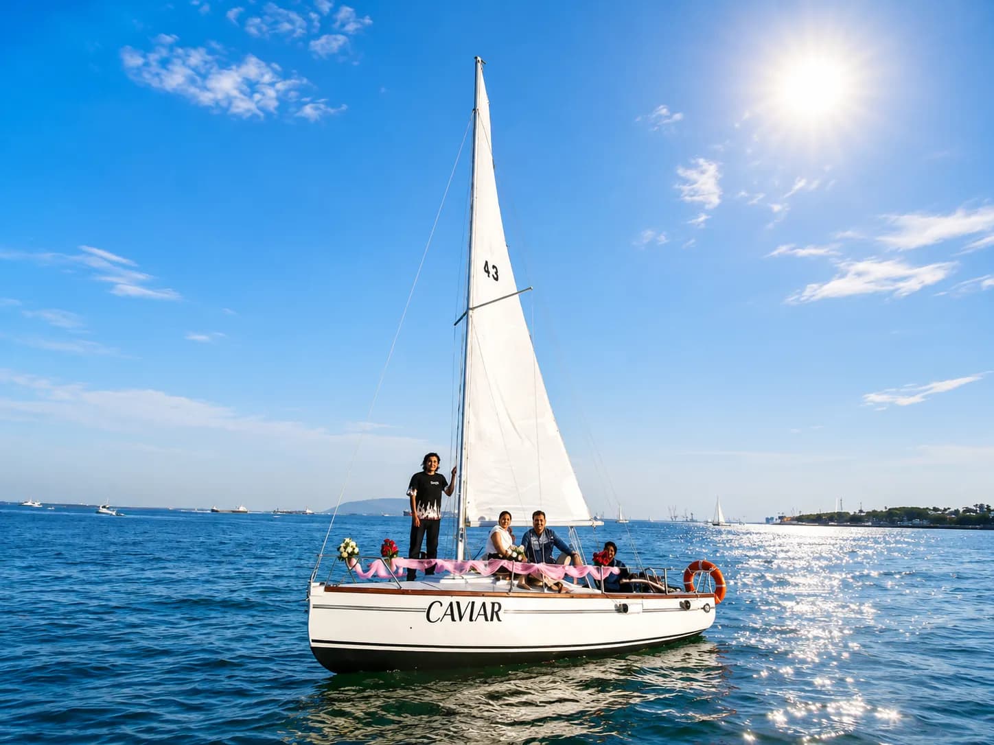 The sailboat Caviar under full sail with a family of guests aboard